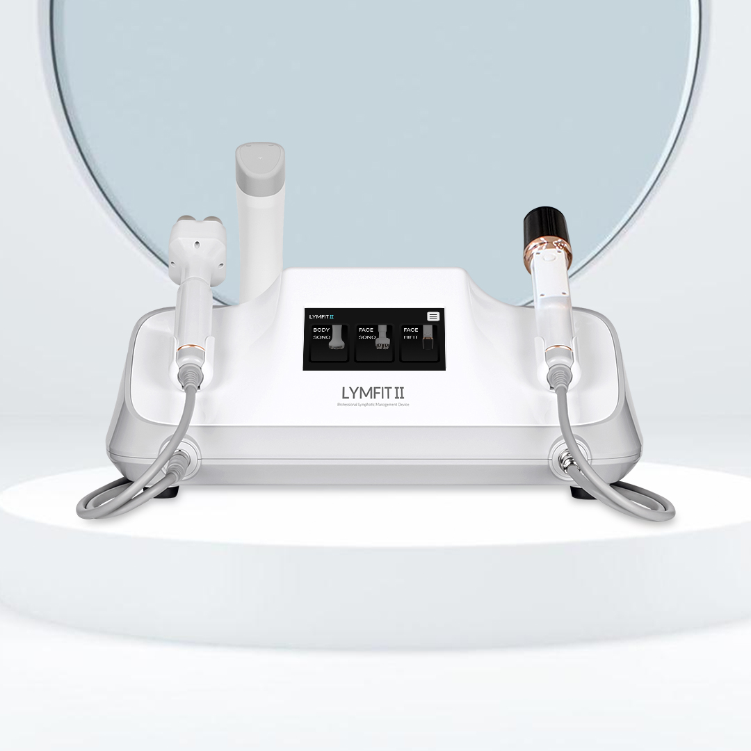 Lymfit2 – Body Sono, Face Sono, HIFU Lymfit2 is a core aesthetic device designed for décolleté and facial lymphatic drainage care, as well as lifting treatments using HIFU technology. 3 Interchangeable Handpieces: Body Sono (Body Ultrasound) – 850 kHz / 2.4 MHz (Dual Frequency) Face Sono (Facial Ultrasound) – 1 MHz / 3 MHz / 10 MHz (Simultaneous Output) Face HIFU – 1.5 mm / 3.0 mm / 4.5 mm (Up to 500,000 shots per cartridge) Product size : W420 x H163 x D245mm Product package size : W495 x H250 x D430mm Product package weight : About 6.5kg Input voltage : AC110V ~ 240V, 60Hz 1.45A Output voltage : DC 42V3A, 130W LCD panel : 5inch (500 x 480 px)